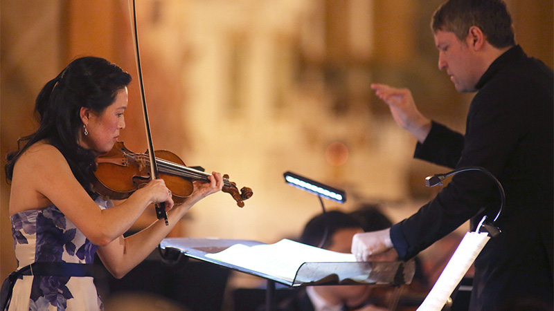 Photo of violinist and conductor